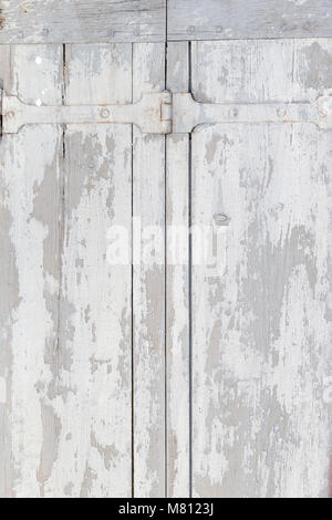 Row of ancient white weathered window shutters background Stock Photo