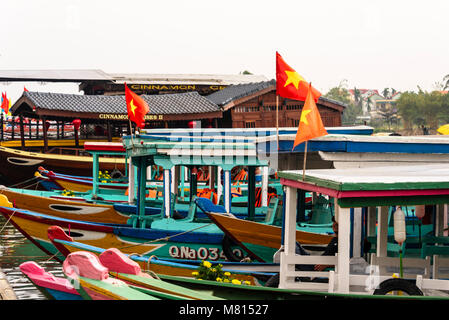 Tourist boats with Vietnamese flags at Hoi An, Vietnam Stock Photo