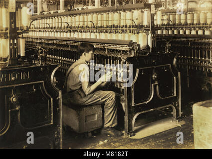 George Courtemonds, 14 years old, Oiler Boy, Oils all Spindles in Spinning Room, King Philip Mills, Fall River, Massachusetts, USA, Lewis Hine for National Child Labor Committee, June 1916 Stock Photo