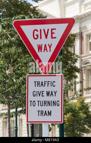 'Give way to turning tram' sign, Cathedral Square, Christchurch, Canterbury, New Zealand Stock Photo