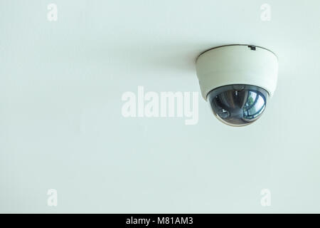 Close up CCTV system installed on the ceiling in the hotel corridor Stock Photo