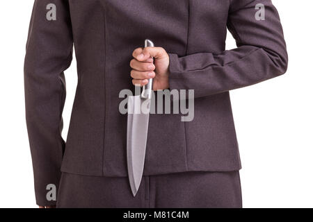 Business criminal concept : Businesswoman holding the new silver knife isolated on white background Stock Photo