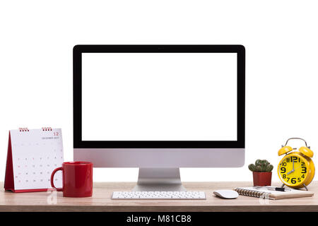 Modern desktop computer, Coffee cup, alarm clock, notebook and calendar on wooden table. Studio shot isolated on white background. Blank screen for gr Stock Photo