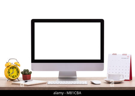 Modern desktop computer, Coffee cup, alarm clock, notebook and calendar on wooden table. Studio shot isolated on white background. Blank screen for gr Stock Photo