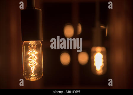 Detailed close up of modern dining room chandelier light bulb Stock Photo