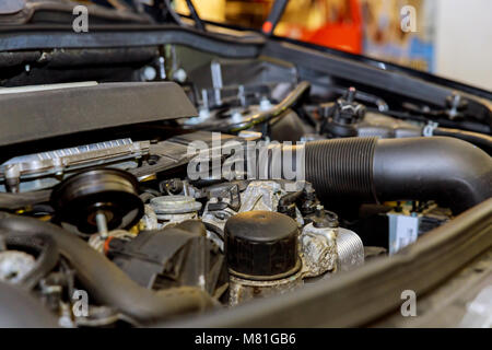 Old and dirty car engine in the garage. motor from the car Stock Photo