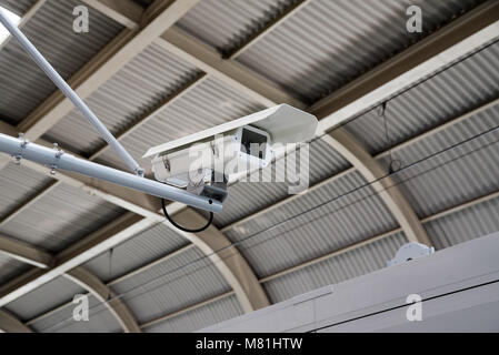 CCTV Camera security operating on subway station platform, underground railways station. Stock Photo