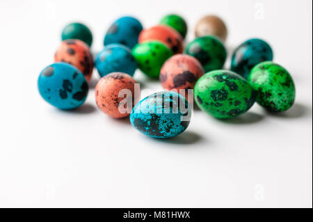 Multi-colored eggs on a light background. Easter background with copy space Stock Photo