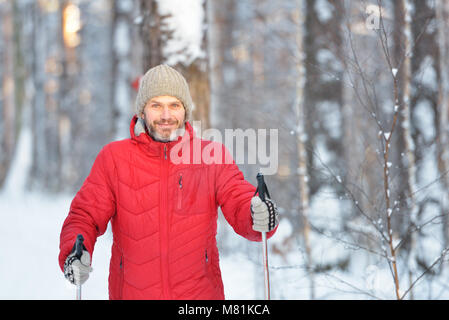 Mature man cross-country skiing Stock Photo