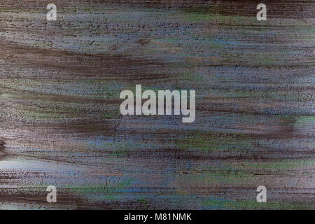 blended horizontal stripes of thick paint in shades of yellow and gray on wooden plank Stock Photo