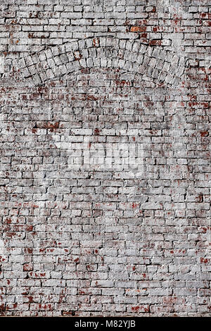A background texture of bricks with an old window arch that have been whitewashed with wihte paint. Stock Photo