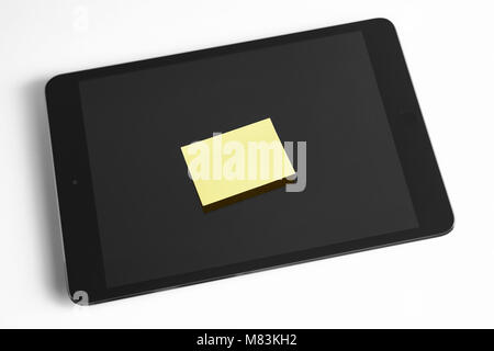 Tablet and adhesive notes on displayisolated on white. Notes Stock Photo