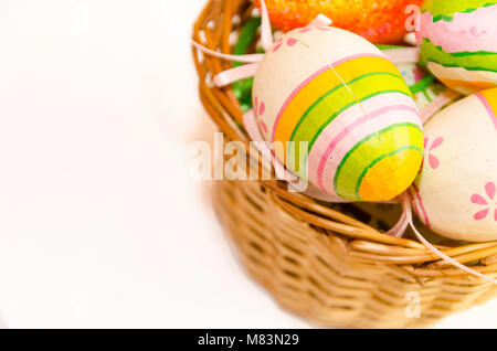 Easter eggs in a wicker basket Stock Photo