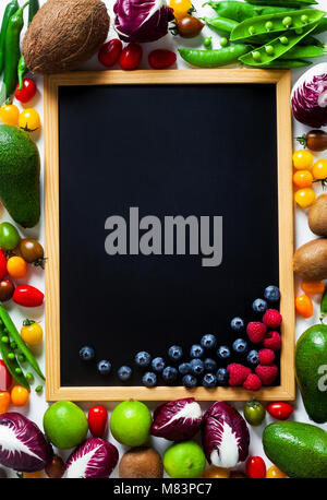 slate board for writing as copy space and different vegetables and fruits background. summer harvest Stock Photo