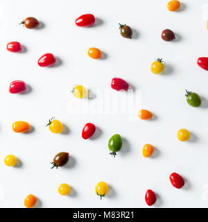 food pattern of colorful small tomatoes and salad. background Creative Cooking food concept. Flat lay, top view Stock Photo