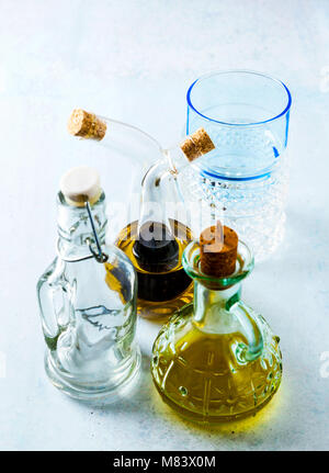 plates and glasses and  cruet with olive oil and balsamic sauce on the table Stock Photo