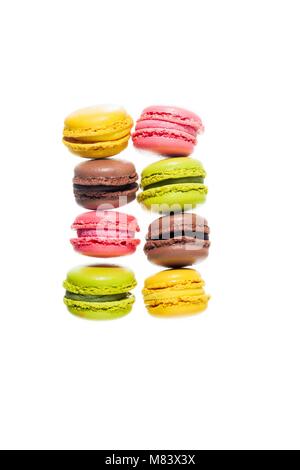 colorful traditional French sweets macaroons from almond flour isolated on white. Stock Photo