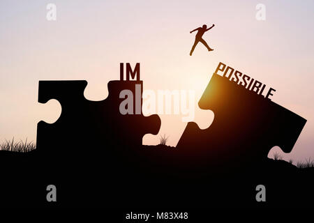 man jumping over jigsaw opposite possible shore, concept as believe and faith to connect business Stock Photo