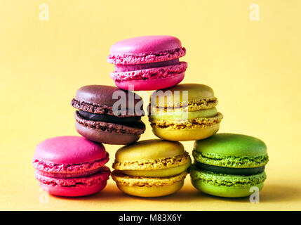 Pyramid of colorful, bright, traditional French Sweet macaroons on retro-vintage background Stock Photo