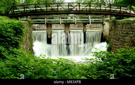 A bridge on a canal spillway Stock Photo