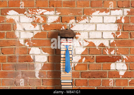 Unusual teacher on background of antique brick wall with World map graffiti Stock Photo