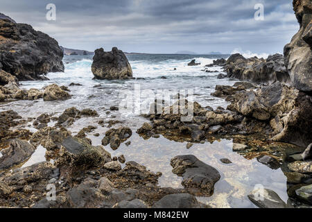 Rock beach near Orzola, Lanzarote, Canary Islands, Spain Stock Photo