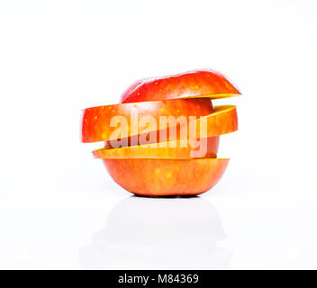 Flying slices of fruit: apple on isolated white background Stock Photo