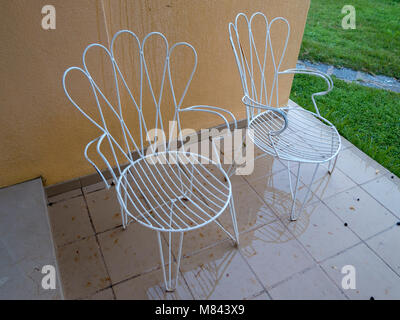 White metal wire outdoor chairs Stock Photo