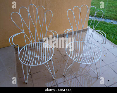 White metal wire outdoor chairs Stock Photo