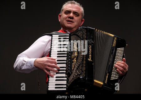 Man playing a piano accordion Stock Photo