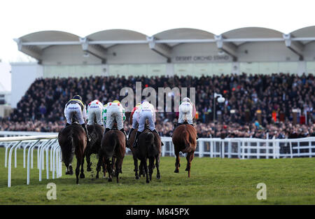 Runners and riders in action in the OLBG Mares' Hurdle during Champion Day of the 2018 Cheltenham Festival at Cheltenham Racecourse Stock Photo