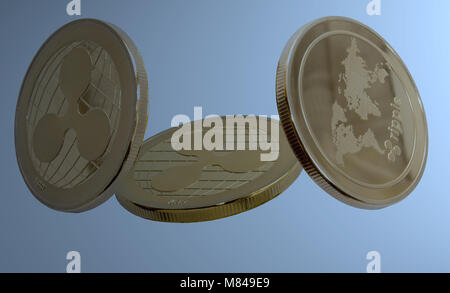 On a blue background are gold coins of a digital crypto  currency - ripple. Stock Photo