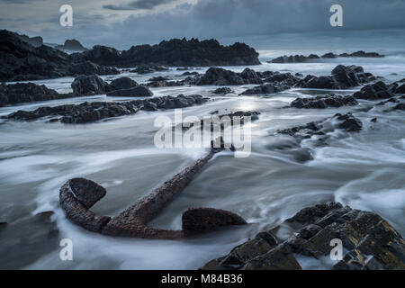 Huge rusted anchor from a shipwreck on the rugged North Devon coast, Devon, England. Winter (January) 2018. Stock Photo