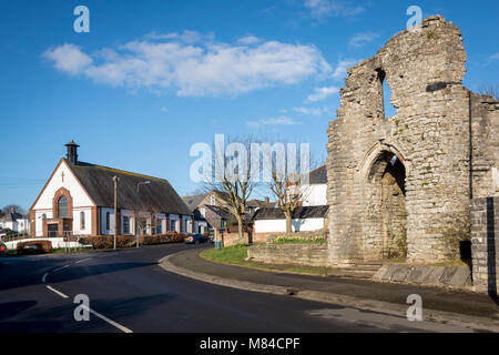 Gatehouse of Barry castle ruin lit by early morning sunshine under a clear blue sky Stock Photo