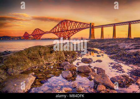 The Forth Bridge, Scotland, basking in the low winter morning sun. Stock Photo