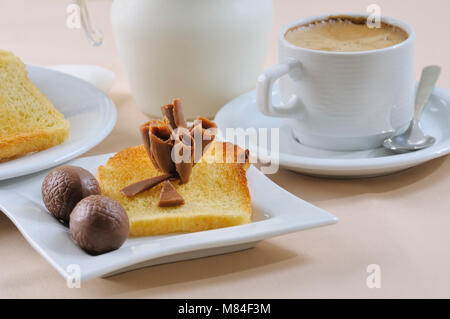 Breakfast with black coffee, toasts, and chocolate Stock Photo