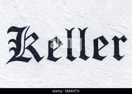 German word Keller, English cellar, painted in Fraktur font at a wall Stock Photo