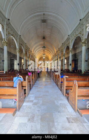 Bacolod, Philippines-October 12, 2016:Filipino Christian devotees pray in the San Sebastian-Saint Sebastian Cathedral church see of the local Roman Ca Stock Photo