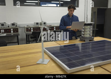 Male worker using laptop in office Stock Photo