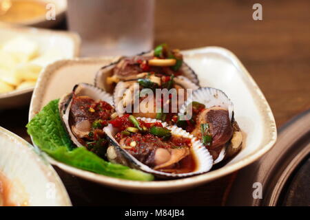 Korean cuisine, side dishes - Marinated blood cockle Stock Photo