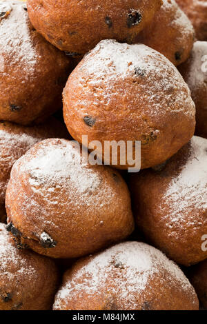 Heap of oliebollen, close up, full frame traditional Dutch pastry for New Year's Eve Stock Photo