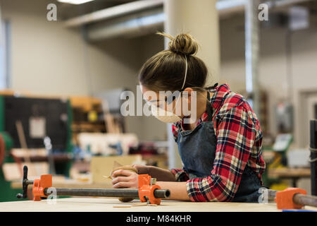 Female carpenter working in workshop Stock Photo