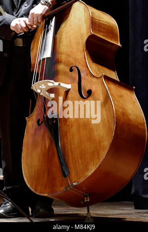 double bass player at a classical music concert Stock Photo