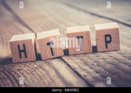 Closeup Of The Word HTTP Formed By Wooden Blocks On A Wooden Floor Stock Photo