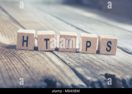 Macro Of The Word HTTPS Formed By Wooden Blocks On A Wooden Floor Stock Photo