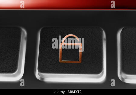 Macro Of A Black Button With Red Opened Security Lock Icon And Backlight Stock Photo