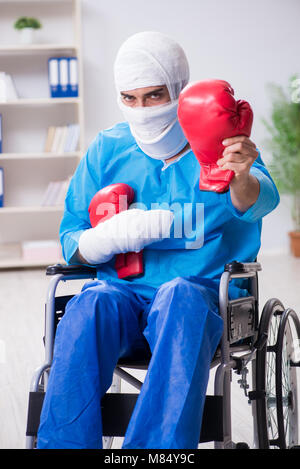 Injured boxer recovering in hospital Stock Photo