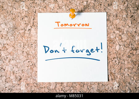 Don't Forget Reminder For Tomorrow On Paper Pinned On Cork Board Stock Photo