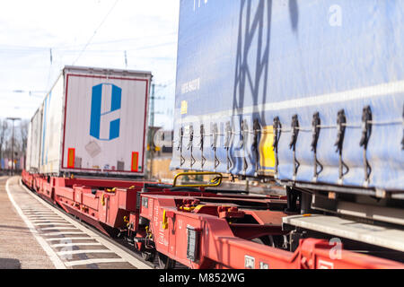 FUERTH / GERMANY - MARCH 11, 2018: a european freight train passes train station Fuerth in Germany Stock Photo