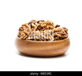 Walnut  kernels in a wooden bowl isolated on white Stock Photo